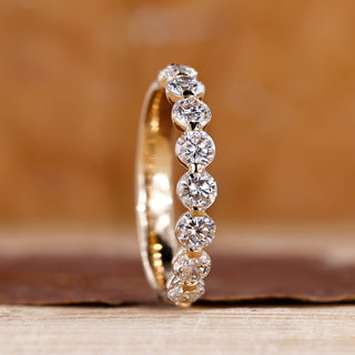 Half eternity band with brilliant diamond accents.
