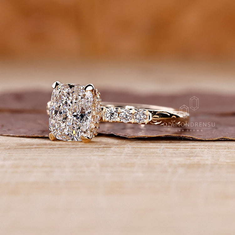 Open gallery setting allows more light to enhance the cushion cut diamond.
