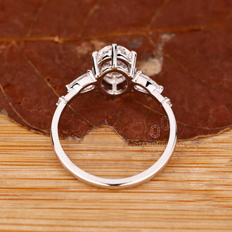 IGI certified handmade ring featuring oval cut diamond and side diamonds.
