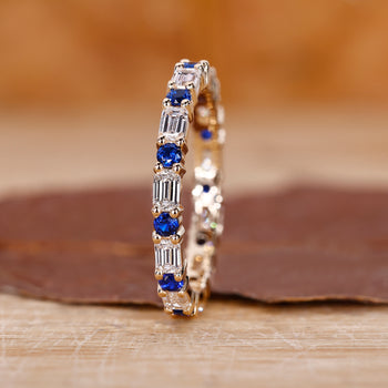 Sapphire eternity band in yellow gold.

