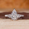 Pear cut diamond ring in white gold with three stone design.
