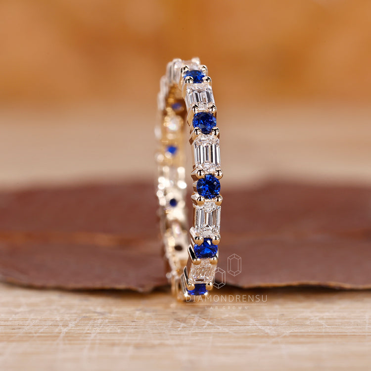 Sapphire and diamond band in yellow gold.
