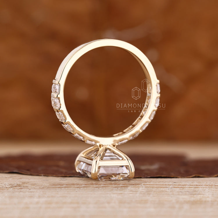 Diamondrensu emerald cut lab grown diamond ring with pave band.