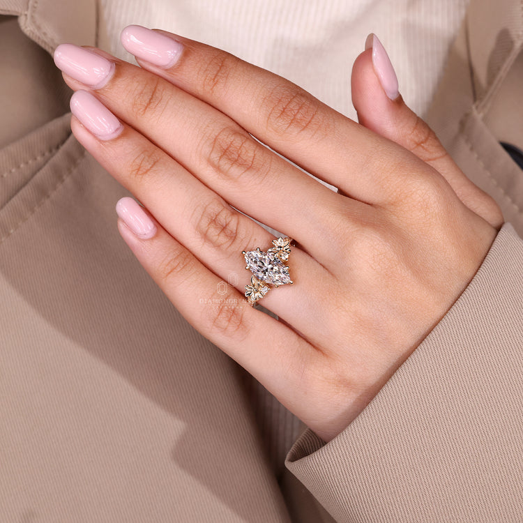 Lab grown marquise ring with nature inspired flower detailing.