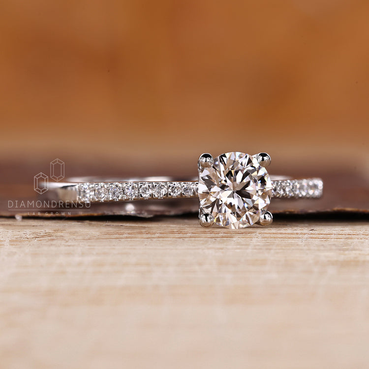 Handmade round diamond engagement ring with round cut pave.
