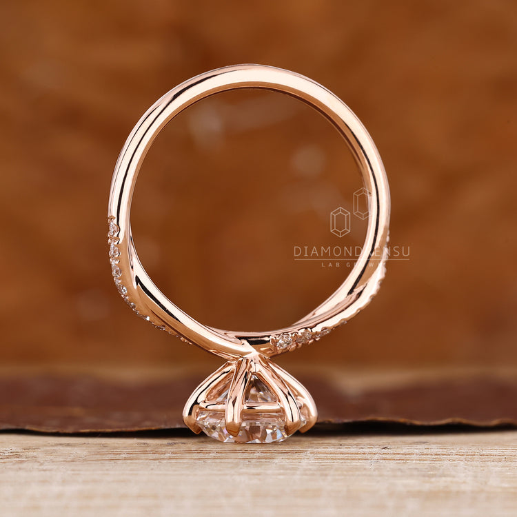Handmade round diamond ring with lab grown diamond and pave band.