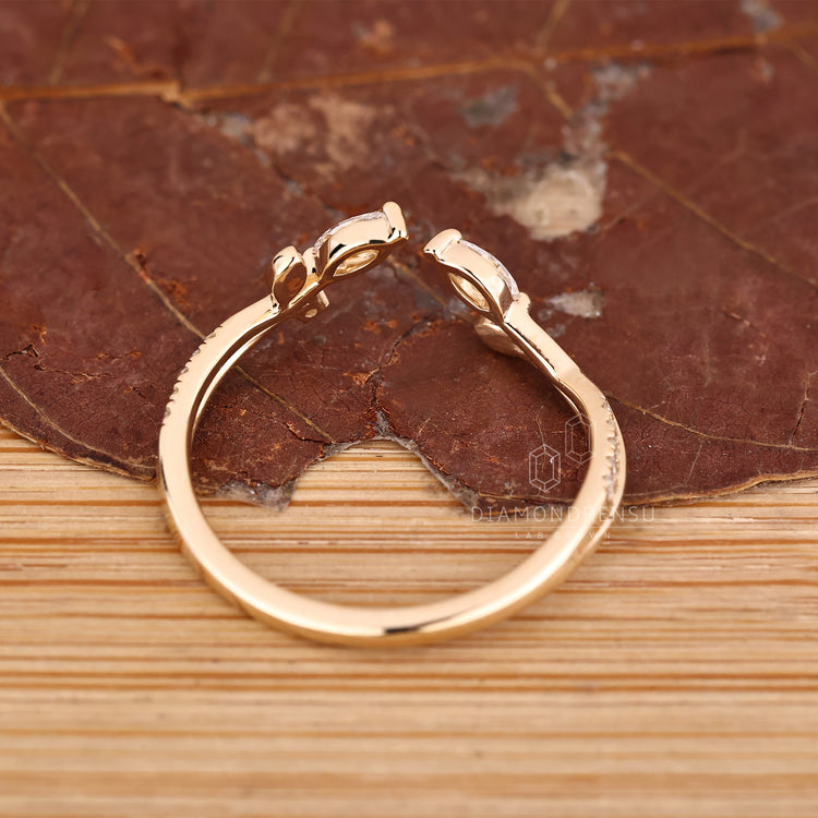 Diamondrensu handmade band with marquise stone and prong setting.