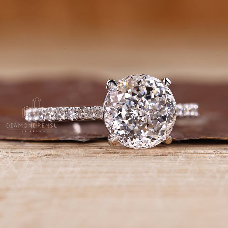Handmade Portuguese cut ring with cathedral setting and pave band.