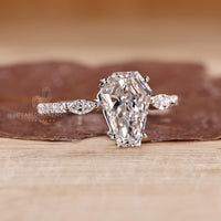 IGI certified coffin shaped diamond ring with four prong setting.
