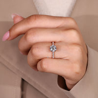 Round cut diamond ring with four prong setting and tulip setting.