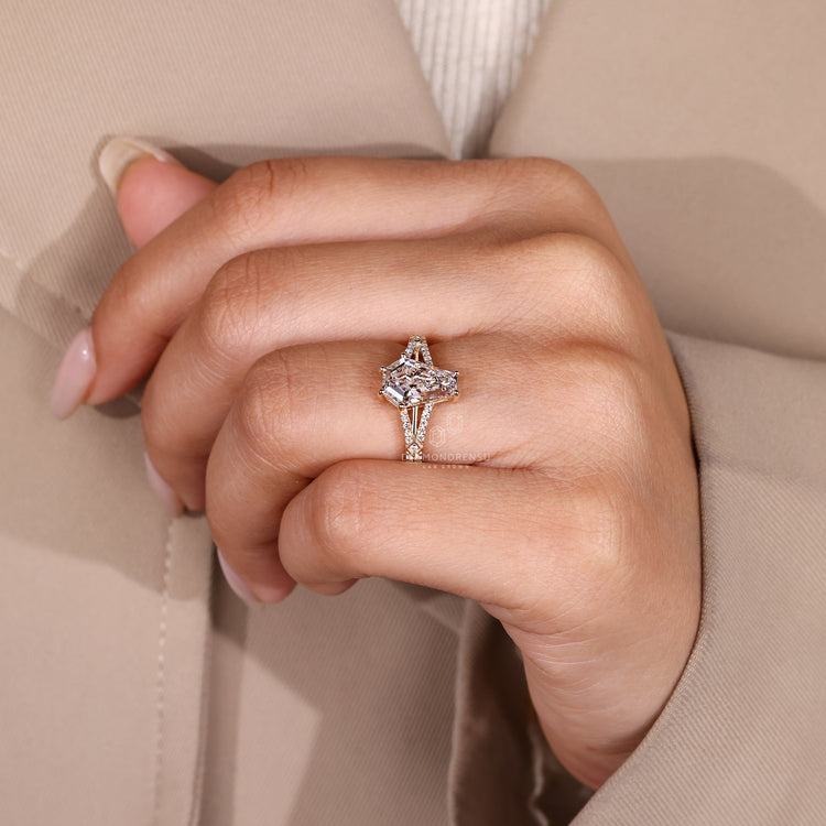 Vintage style engagement ring with split shank and pave details.
