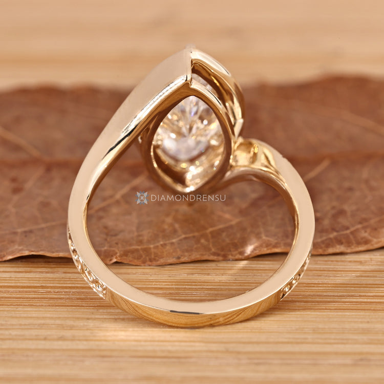 Marquise diamond ring with six claw prong setting.