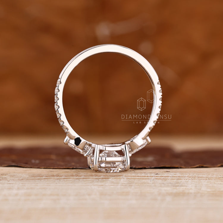 Coffin cut diamond ring with basket setting and prong design.