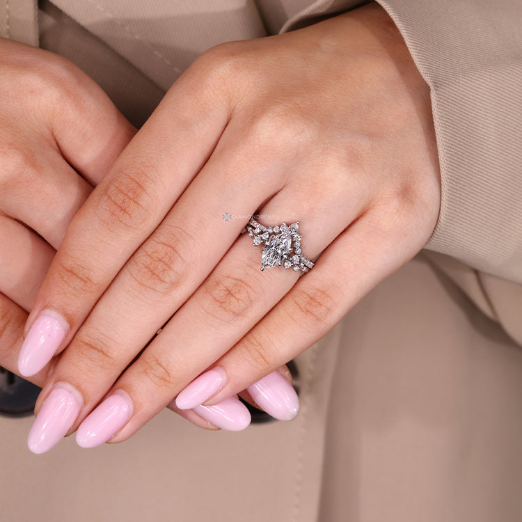 Stackable marquise wedding ring with curvy band design.