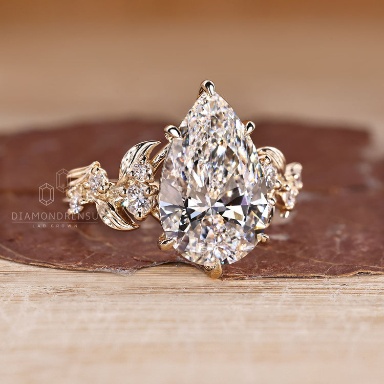 Pear cut diamond ring in six claw prong setting.
