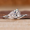 Pear solitaire engagement ring featuring east west setting crafted by Diamondrensu.
