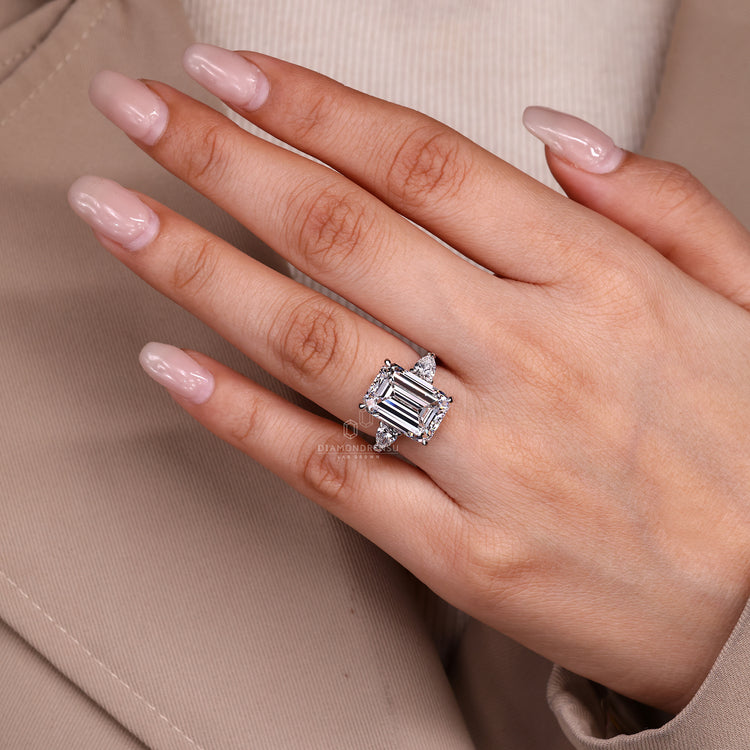 Three stone lab grown diamond ring with hidden halo detail.
