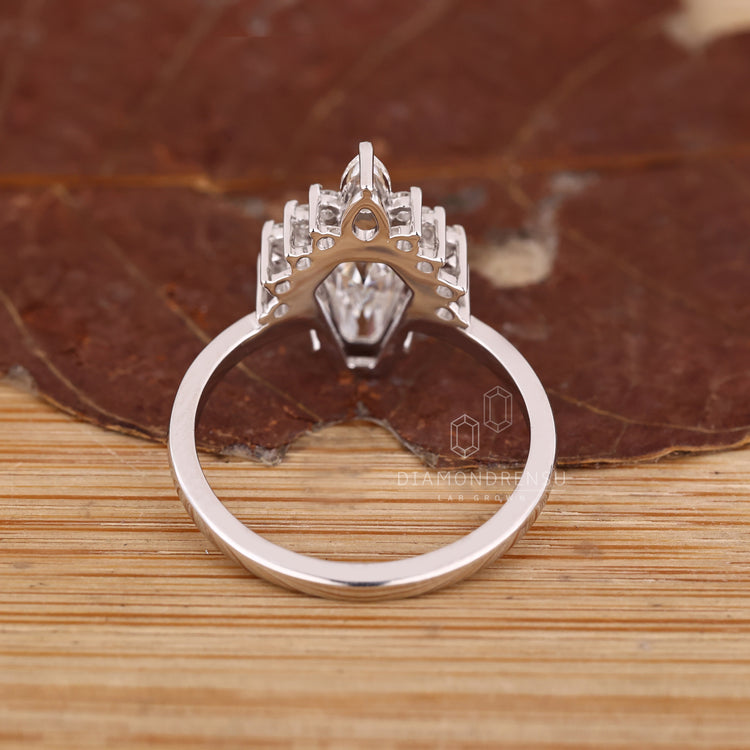 Handmade vintage style ring with pear and round side stones.