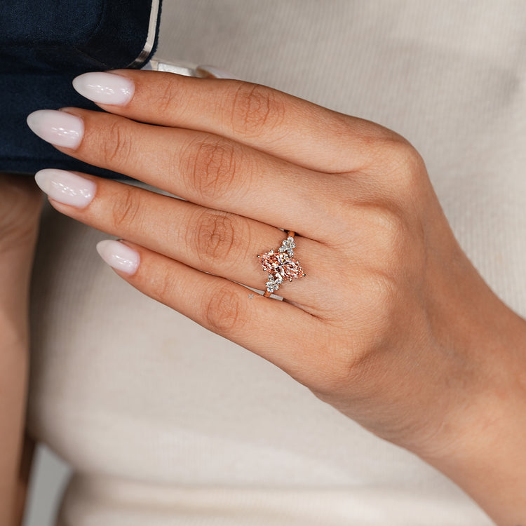 Marquise engagement ring with round and marquise side stones.