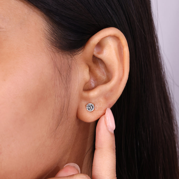 Portuguese cut diamond earrings with secure three prong setting.