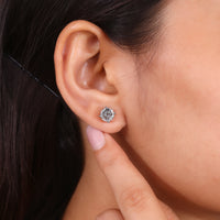 Portuguese cut stud earrings with four prong diamond setting.