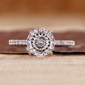 Portuguese cut ring with round cut pave band and cathedral setting.