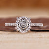 Portuguese cut ring with round cut pave band and cathedral setting.