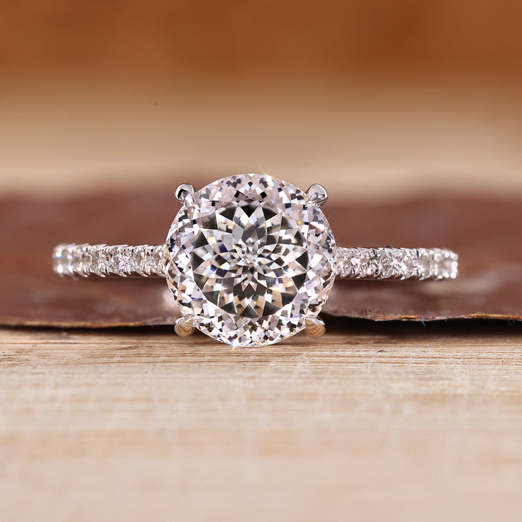 Portuguese cut ring with round cut pave band and cathedral setting.
