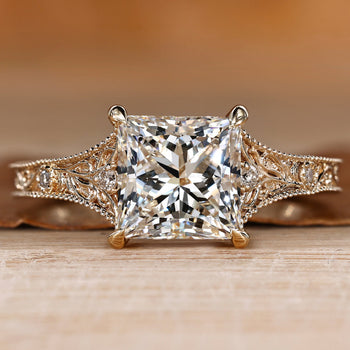 Art Deco engagement ring with a princess cut center stone.