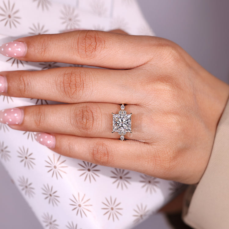 Muse setting princess cut diamond ring with seven stones.
