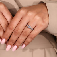 White gold engagement ring with custom diamond setting.
