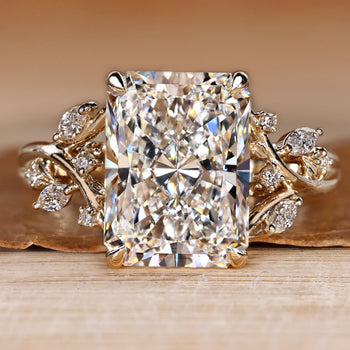 Radiant cut diamond ring with marquise side stones.