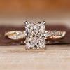 Radiant cut diamond ring with twisted shank and twisted pave band design.
