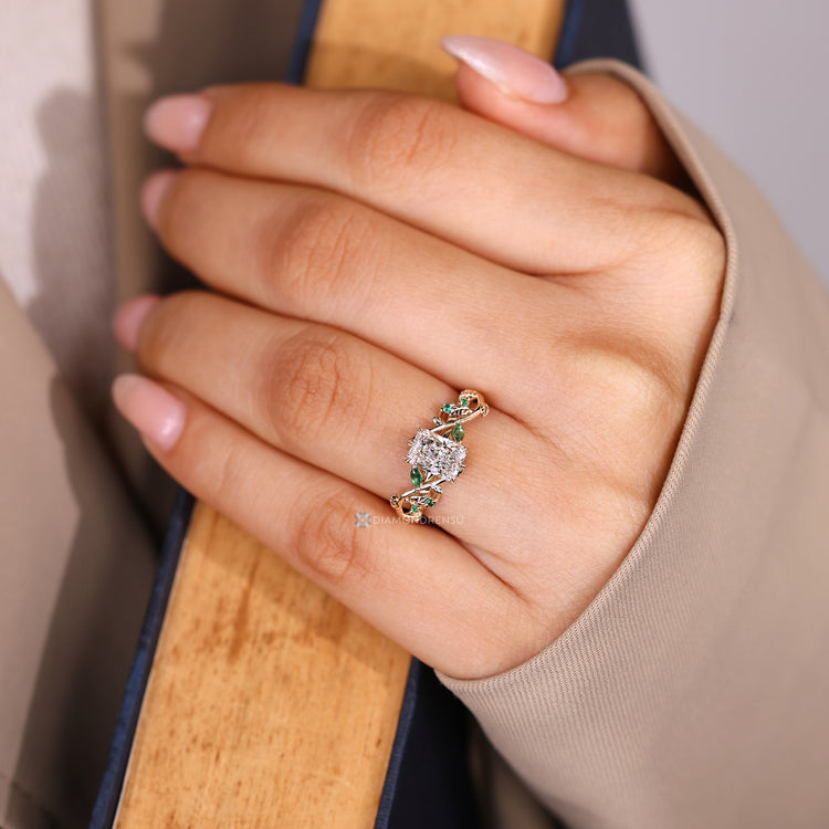 Nature inspired engagement ring with round side stones.