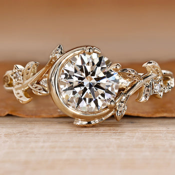 Bezel engagement ring with round center diamond.