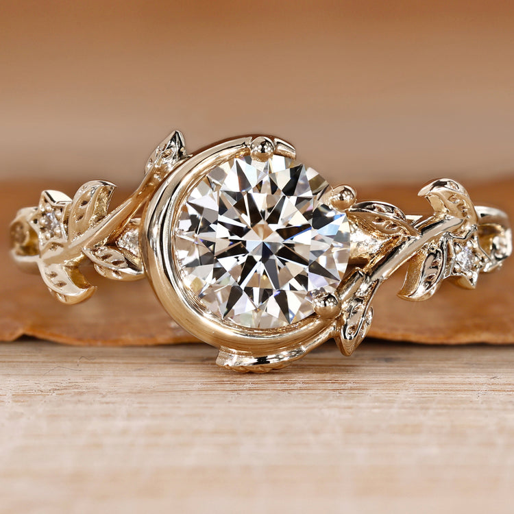 Bezel engagement ring with round center diamond.