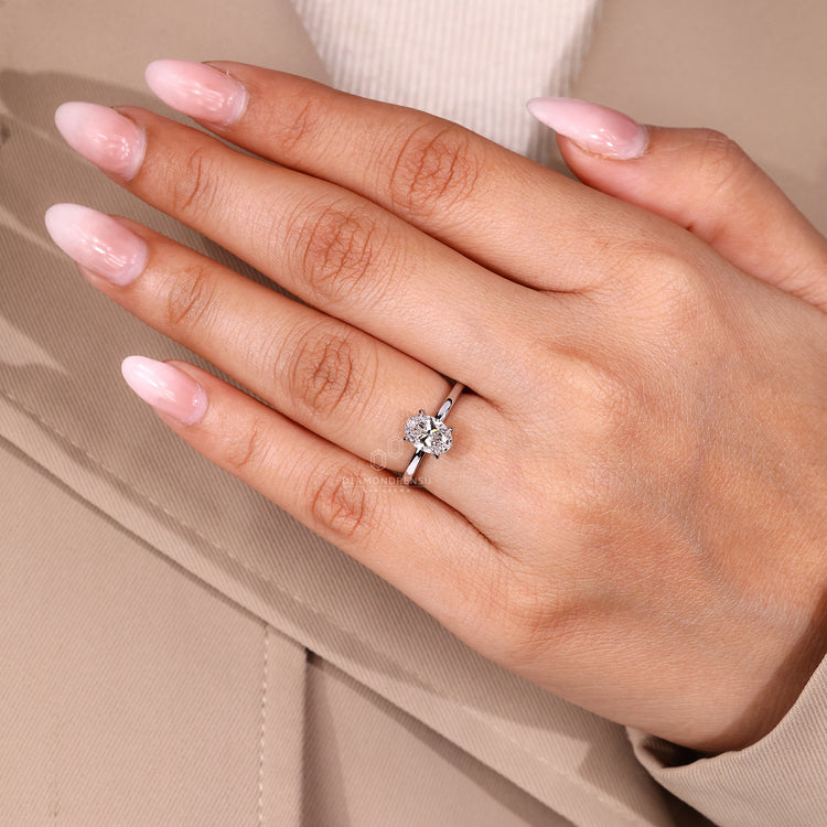 Oval diamond ring with lab grown diamond and solitaire design.