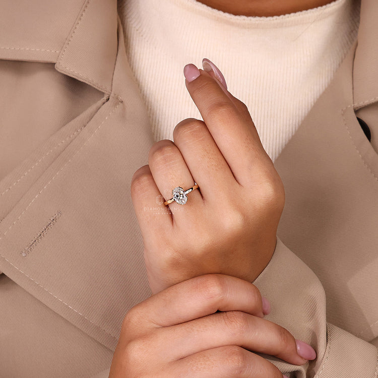 Handmade solitaire ring with oval cut diamond design.