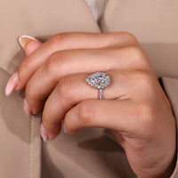 IGI certified pear cut diamond engagement ring with three claw prongs.