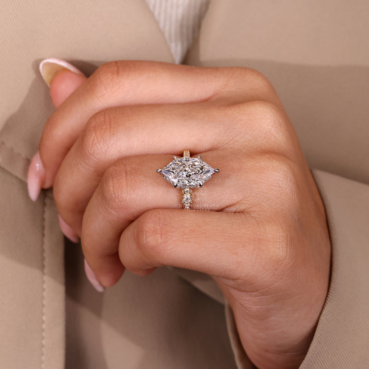 Handmade Dutch marquise engagement ring with pave band and cathedral setting.