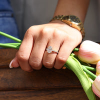 IGI certified oval cut diamond ring with four claw prong setting.