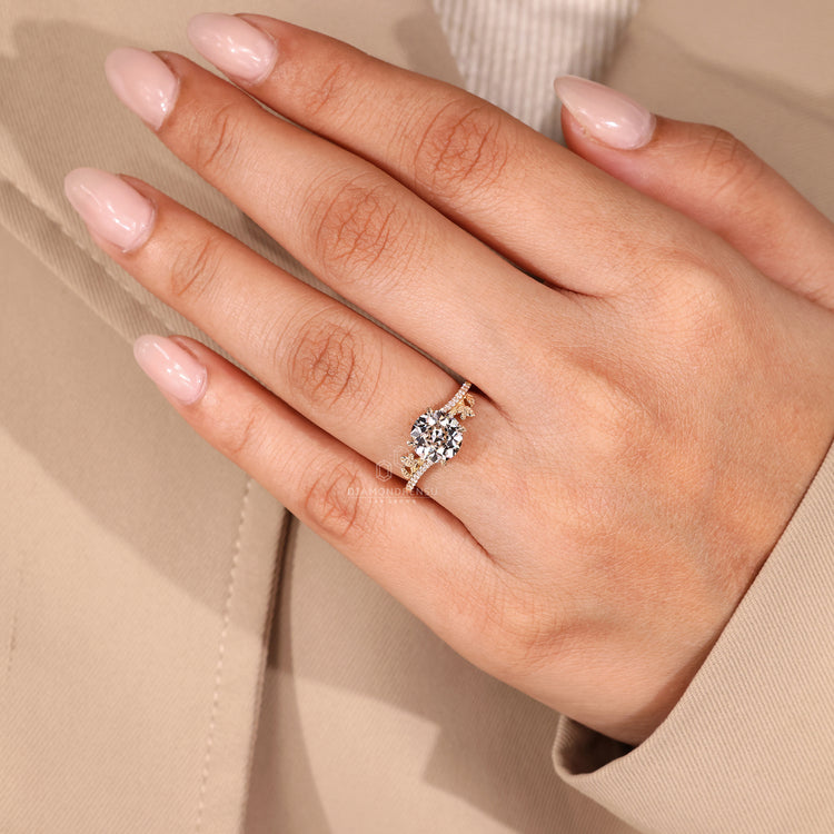Handmade ring with round old european cut diamond and leaf inspired setting.
