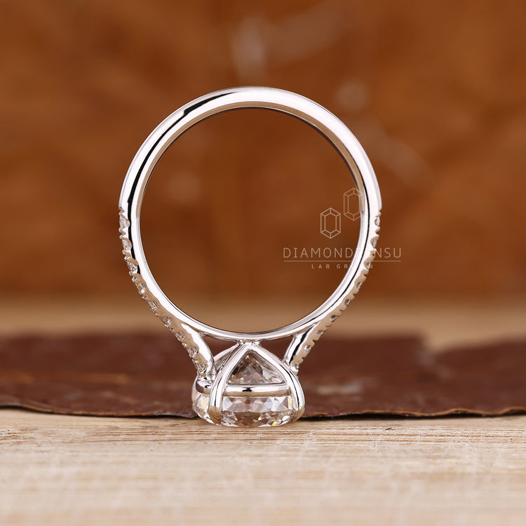 Handmade Portuguese cut ring with four claw prong and round accents.