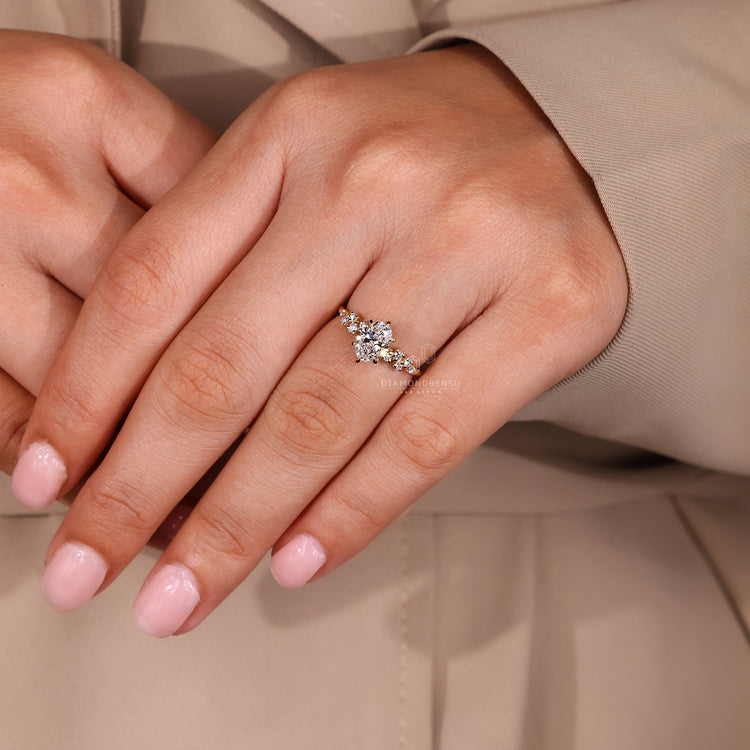 Handmade oval ring with round stones and claw prongs.