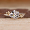 Nature inspired ring with round old european cut diamond leaf design.
