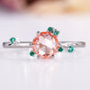 Round rose cut diamond ring with green emerald and peach gemstones.