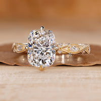 Cushion cut diamond ring with a tulip setting.