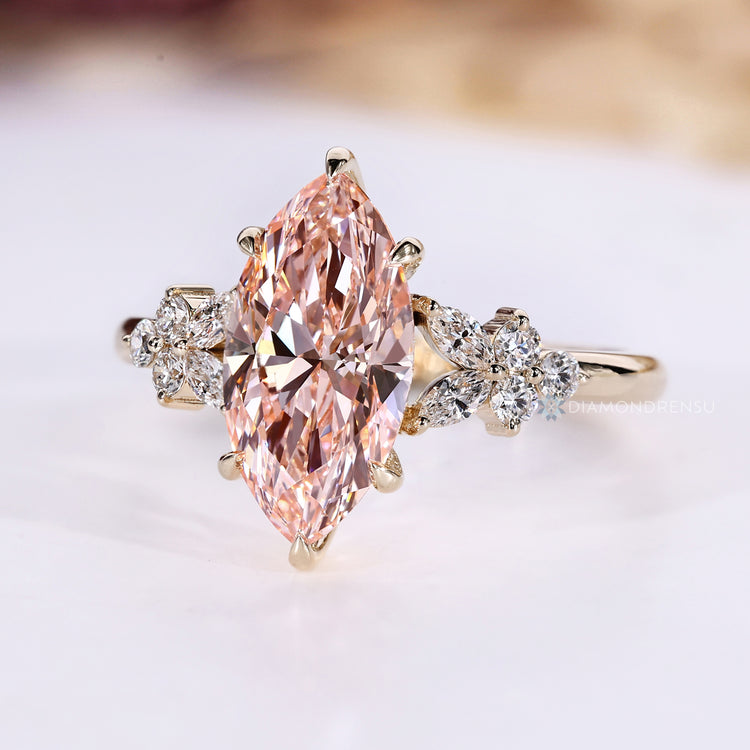 Marquise lab grown diamond ring with side stones.