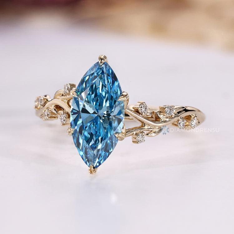 Handmade blue marquise engagement ring by Diamondrensu.