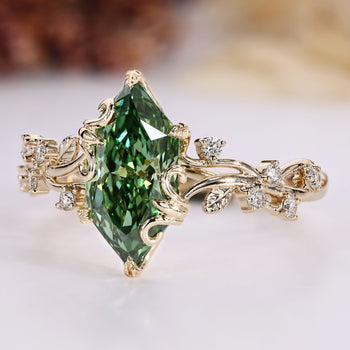 Nature inspired engagement ring with green dutch marquise and round side stones.